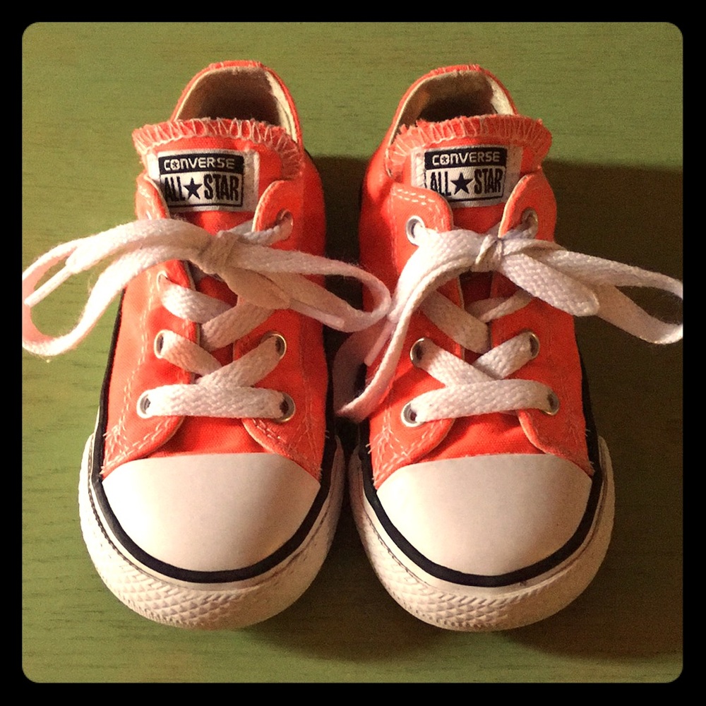 Fluorescent orange Converse All Stars